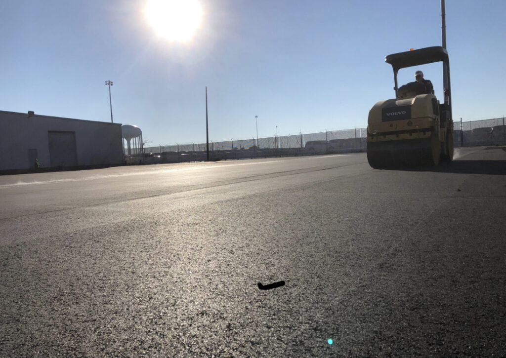 Rolling a fresh asphalt lot