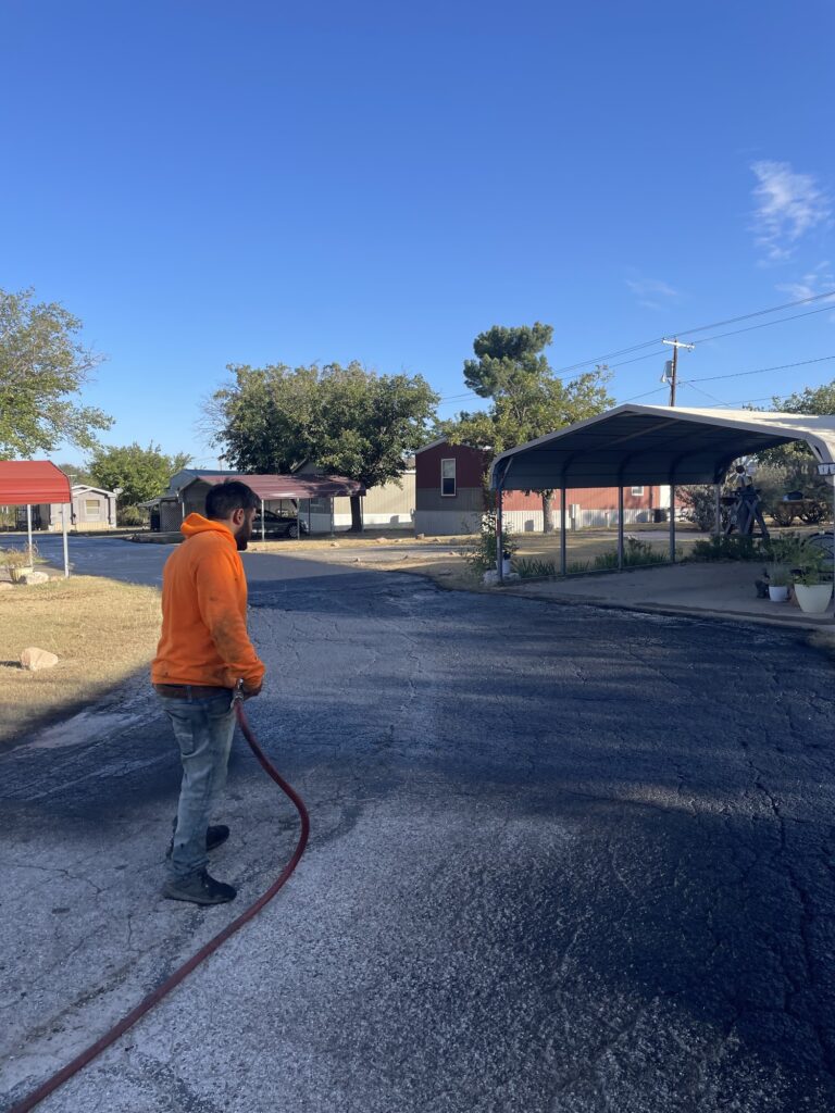 Applying tack coat before paving