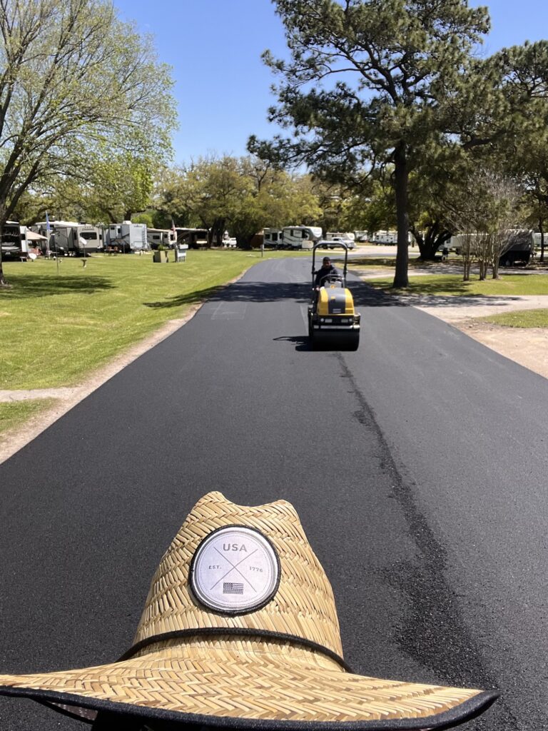 Rolling a new asphalt driveway