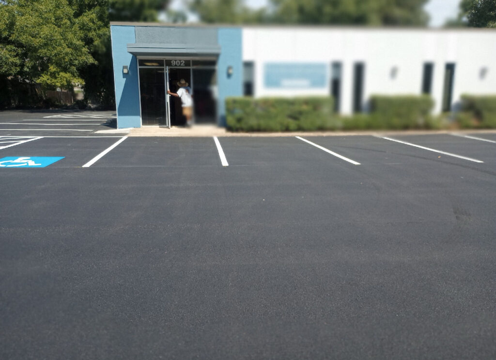 Striped parking lot with an accessible space