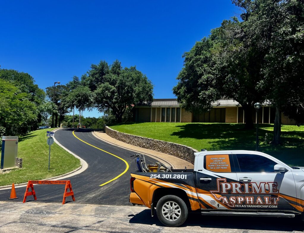 Curving asphalt road with fresh striping