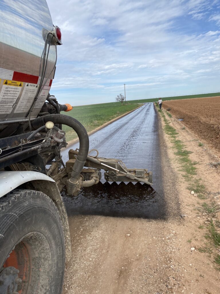 Paving a rural road through farm fields