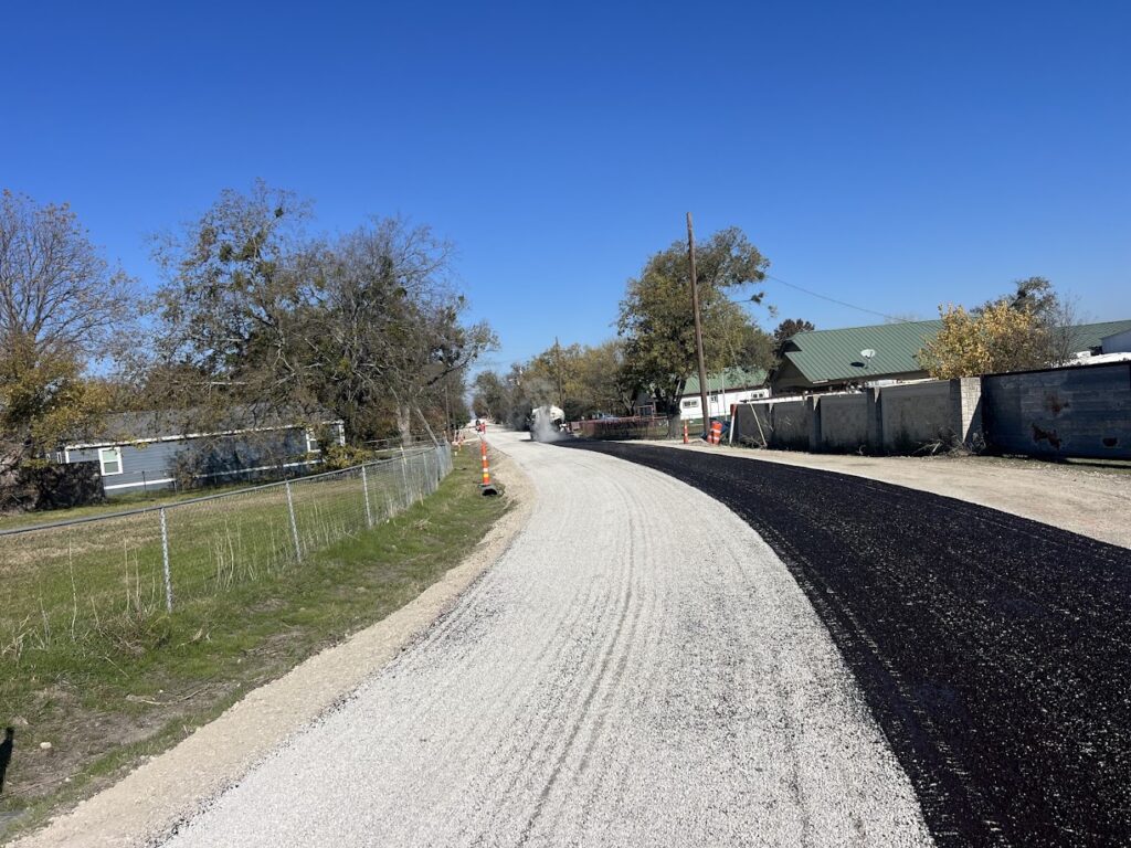 Chip seal going down on a rural road